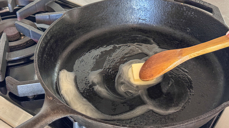 wooden spoon stirring butter