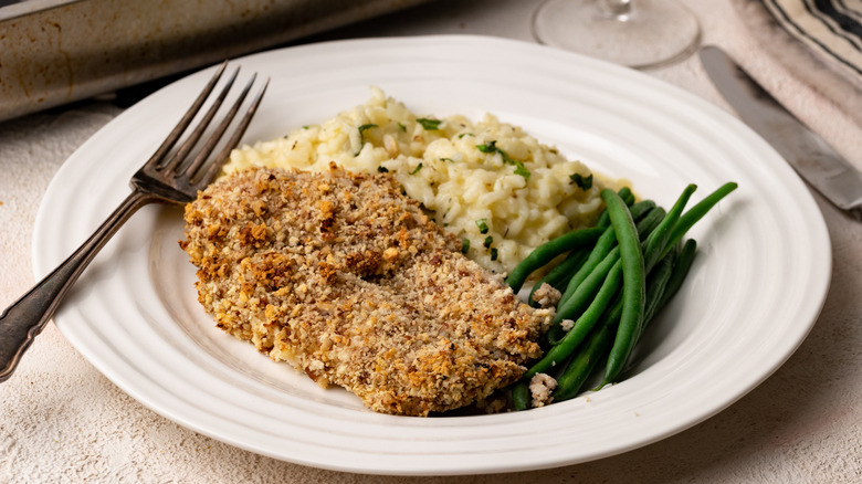 pecan-crusted chicken breast on plate 