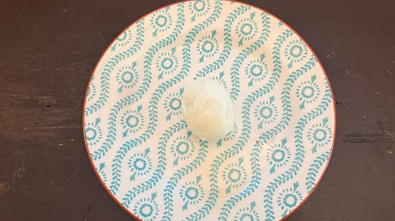 a hard-boiled egg poorly peeled
