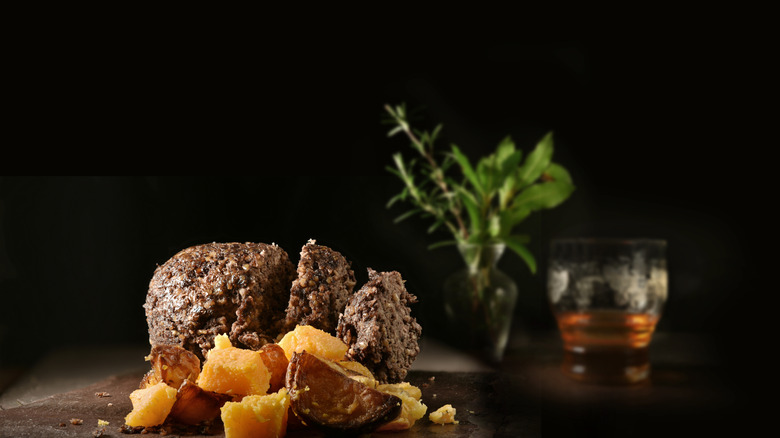 haggis on stone board in dark room