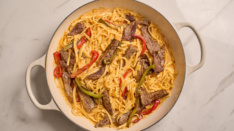 pepper steak alfredo in a skillet