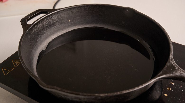 heating oil in a skillet