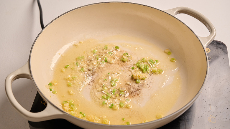 cooking aromatics in a skillet