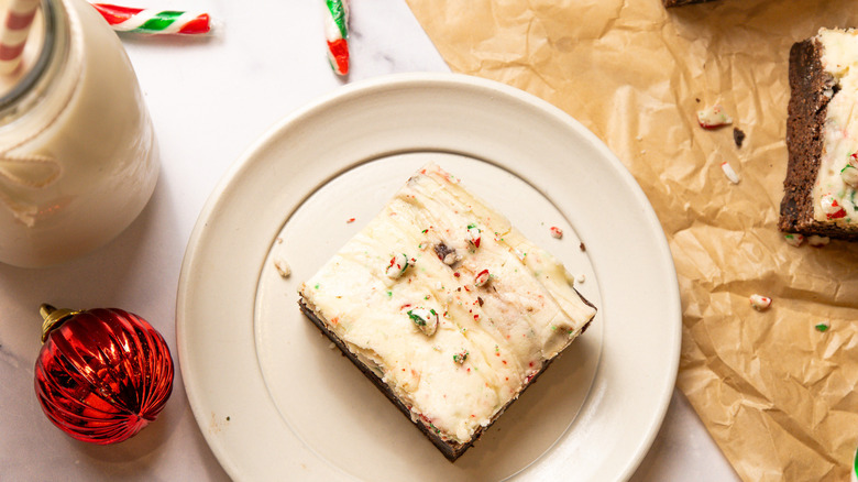 A peppermint bark cookie bar on a plate