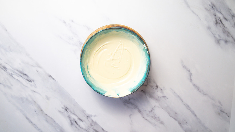 Melted white chocolate in bowl