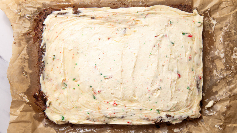 Uncut peppermint bark cookie bars on parchment paper
