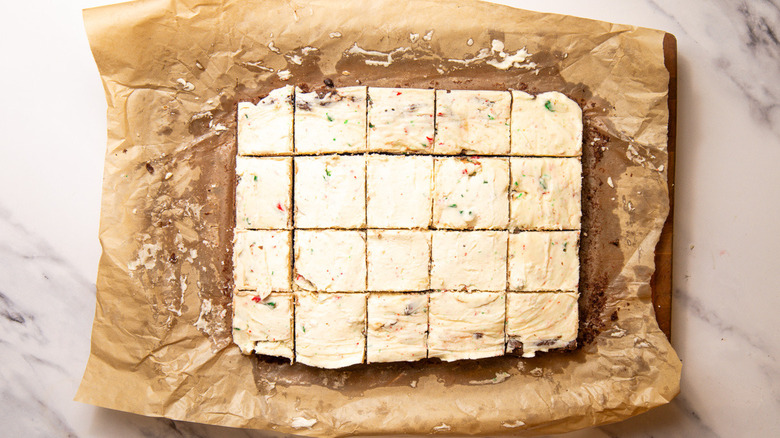 Peppermint bark cookie bars on parchment paper