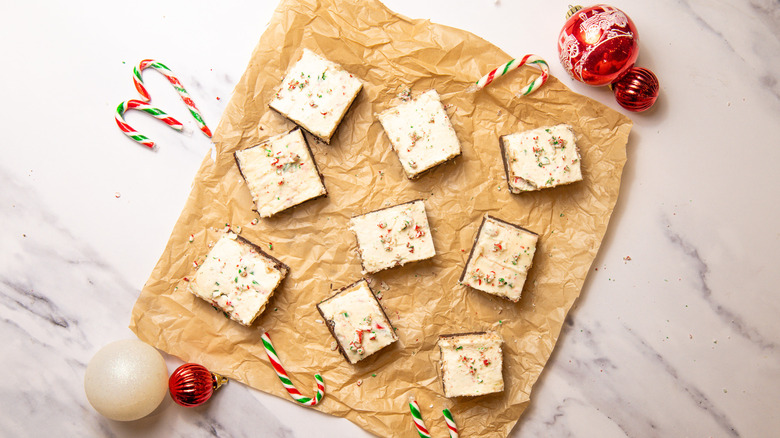 Peppermint bark cookie bars on parchment paper