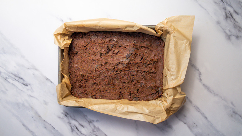 Chocolate brownie dough in pan