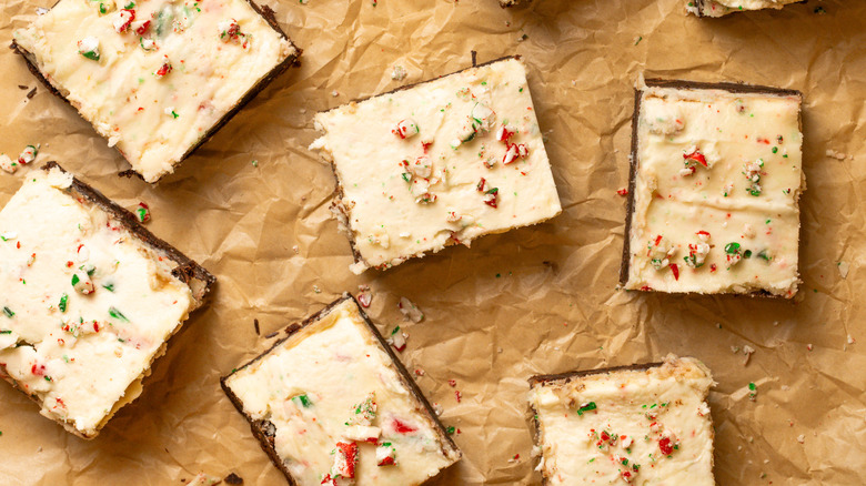 Peppermint bark cookie bars on parchment paper