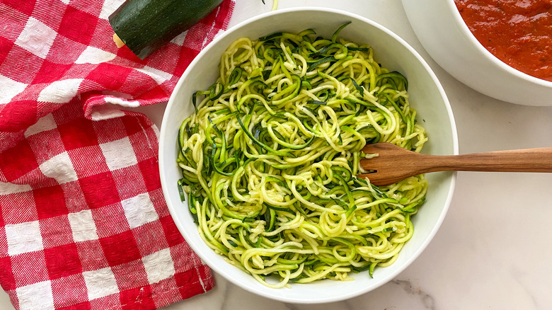 zucchini noodles in white bowl