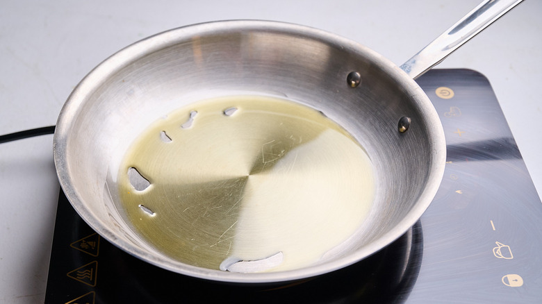 heating oil in a skillet