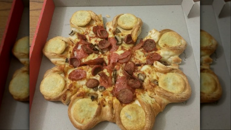 A Pizza Hut Four'N Twenty Stuffed Crust Pizza in a box