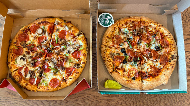 Two big supreme pizzas side by side