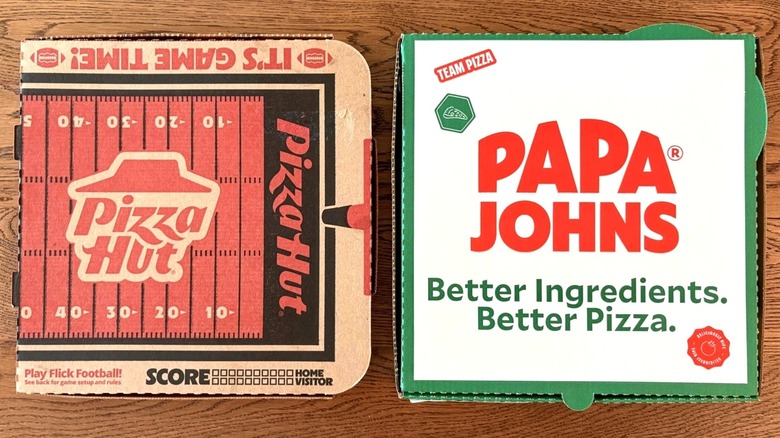 Two boxes of pizza next to each other