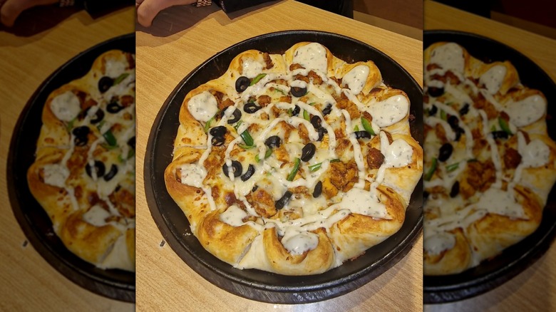 Pizza Hut's Cheeseburger Crust Pizza on wooden table