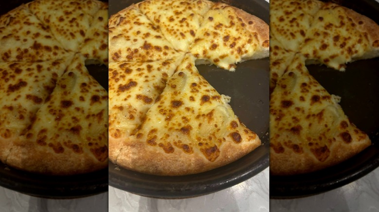 Pizza Hut's Durian Pizza on black plate