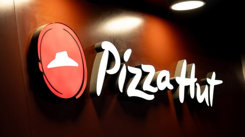 Pizza Hut sign on black background