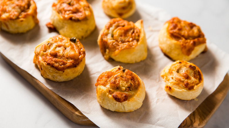 pizza pinwheels arranged on board