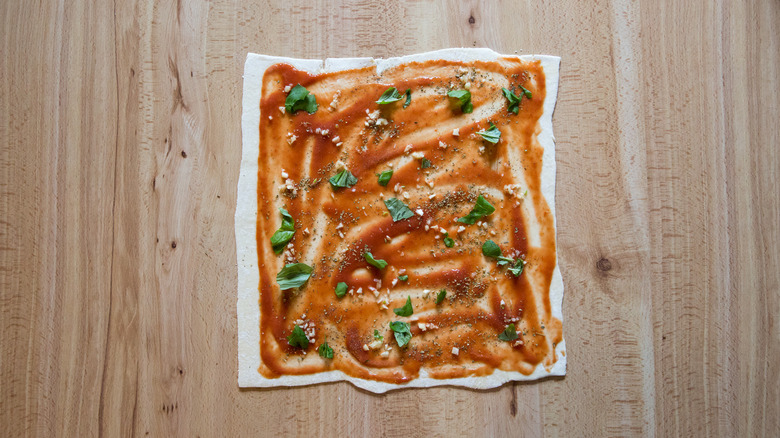 flavored tomato on pastry sheet