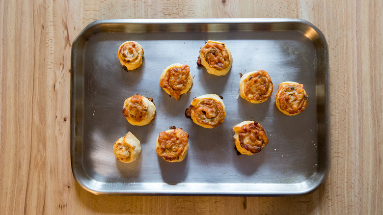 pizza pinwheels on baking sheet