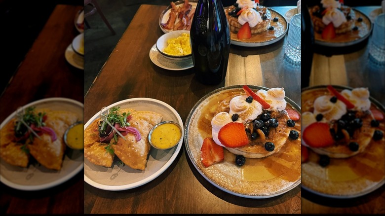 Empanadas and pancakes on wooden table at El Puro Cuban Restaurant in Charlotte, NC