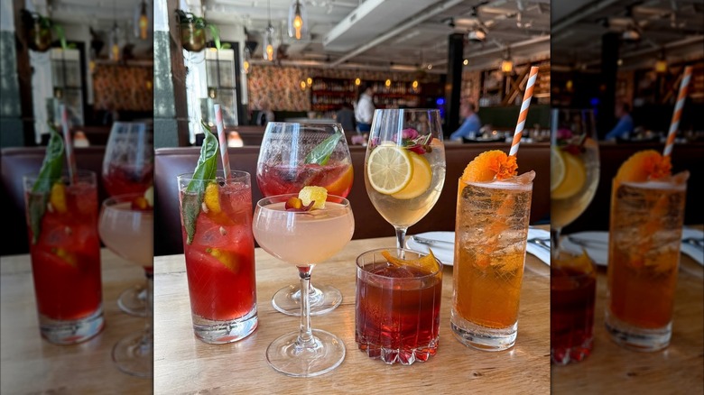 Six cocktails on table in different styles of glasses at Ever Andalo in Charlotte