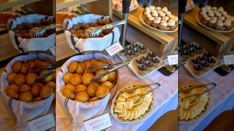Biscuits, muffins, cupcakes, butter, and jam on buffet table at Supperland