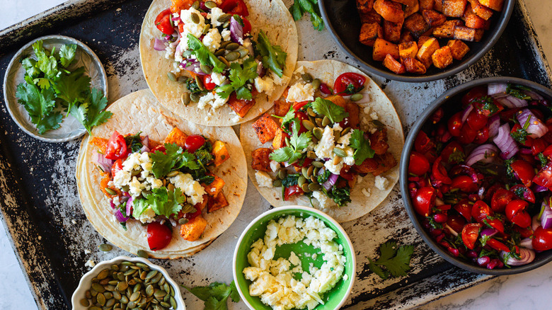 Overview of butternut squash tacos with pomegranate pico