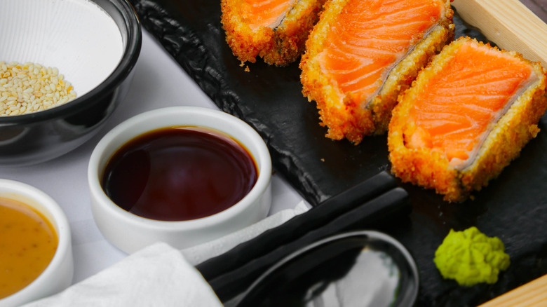 A ponzu dipping sauce beside sushi