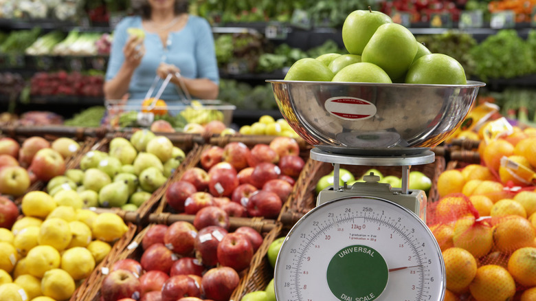selection of apples at grocery store