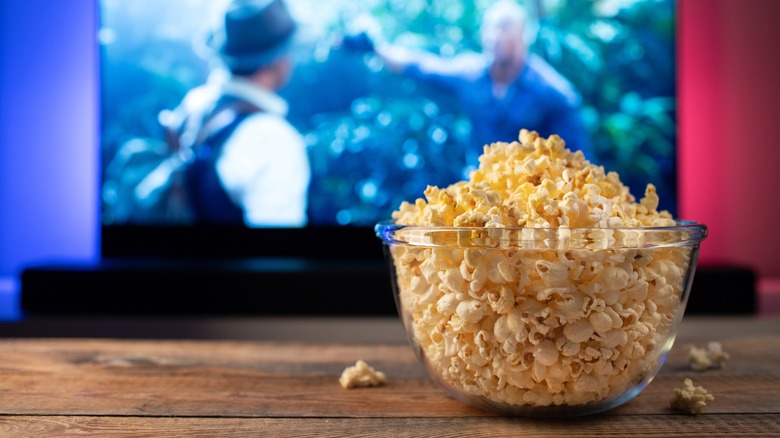 bowl of popcorn in front of TV