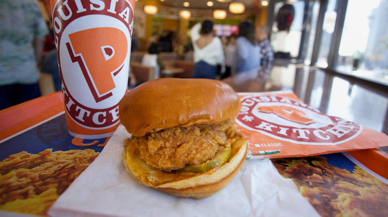 Close-up of a Popeyes chicken sandwich