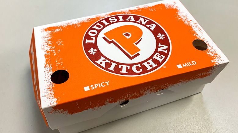 box of popeyes chicken.