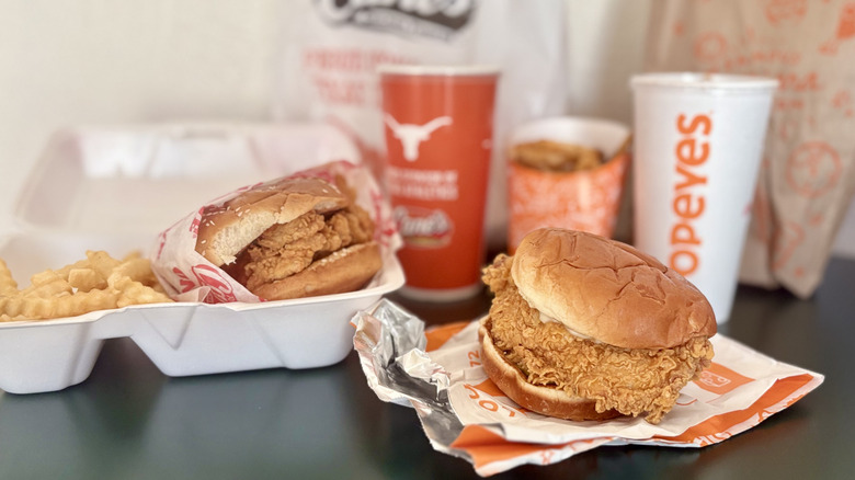 two fried chicken sandwiches next to each other