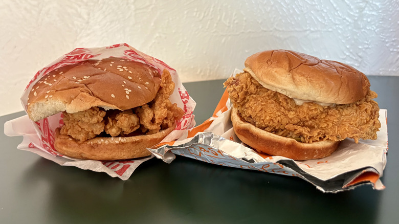 fried chicken between buns sandwiches with wrappers