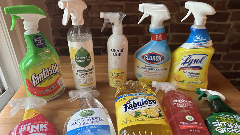 All-purpose kitchen cleaner bottles arranged on wooden table