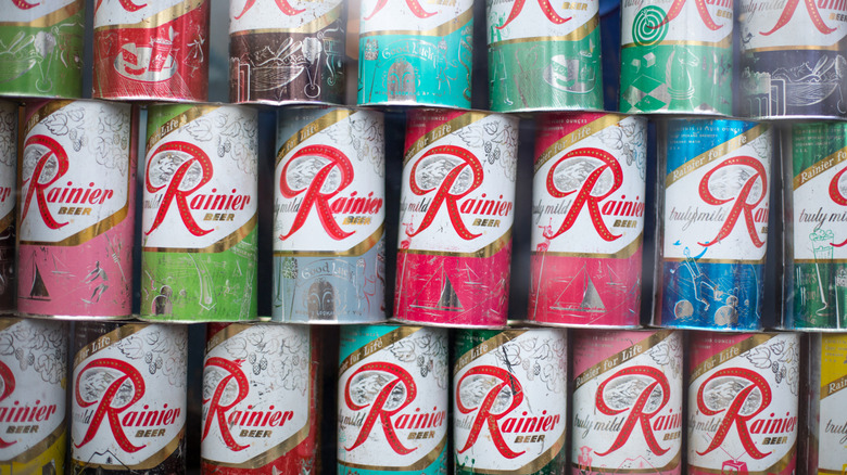 Old Rainier beer cans stacked on top of one another