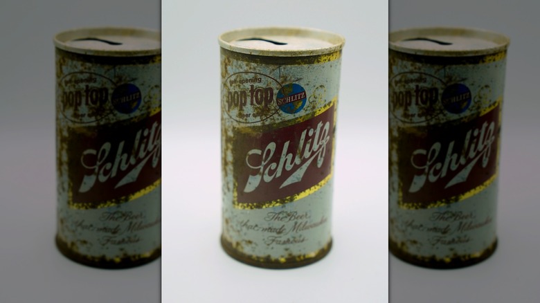 An old and rusty can of Schlitz beer