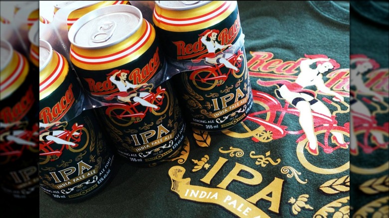 Cans of Red Racer IPA with a shirt