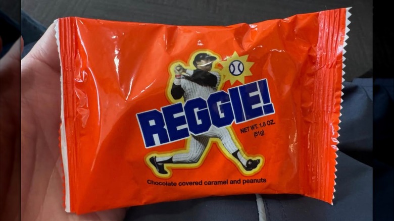 Man holding Reggie Candy Bar
