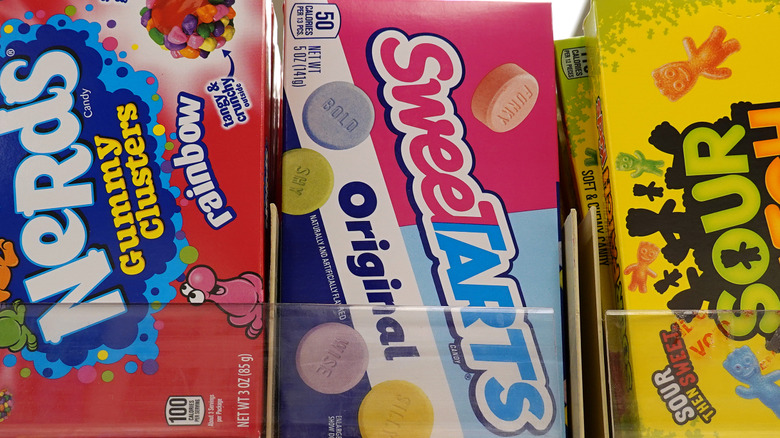 Store shelf of candies including SweeTarts