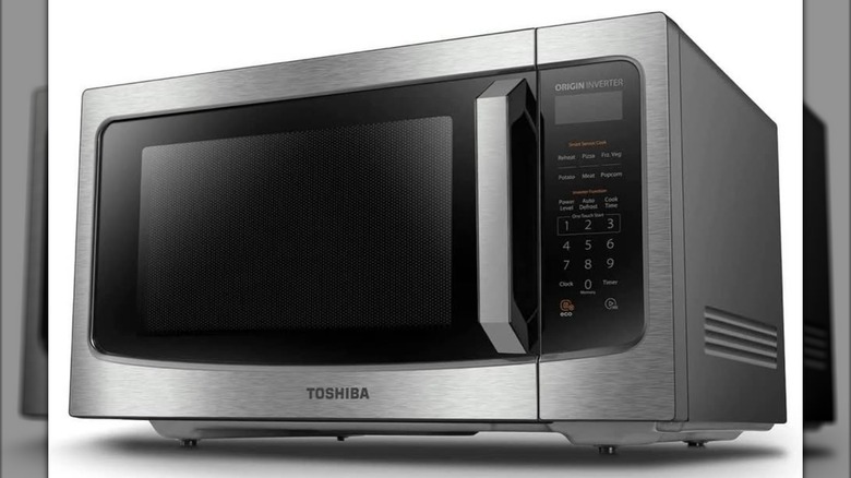 Toshiba countertop microwave oven on a white background.