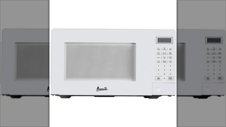 Avanti white microwave on a white background.