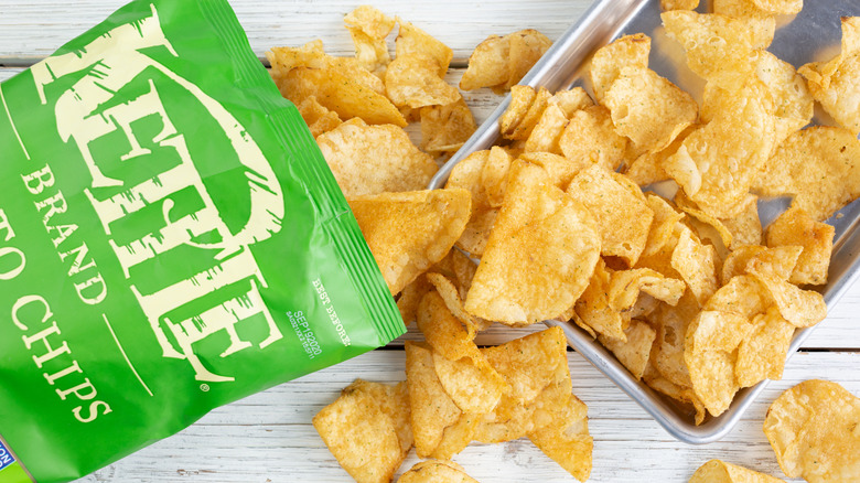 An opened bag of Kettle Chips on table