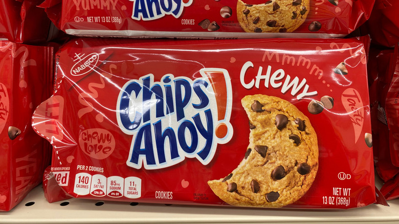 A container of Chips Ahoy! Chewy cookies on grocery store shelf