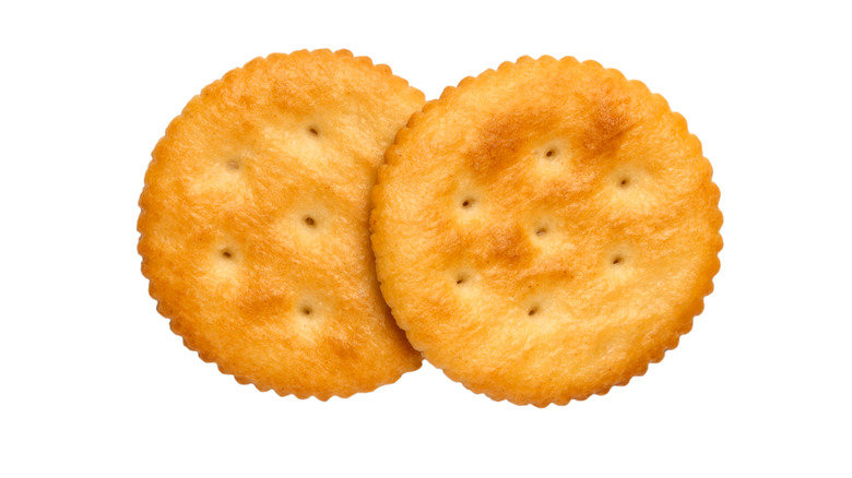 Two Ritz Crackers against white background