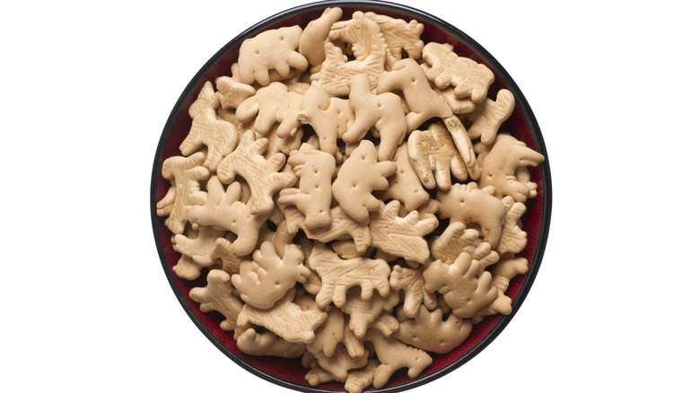 Bowl of animal crackers on a white background