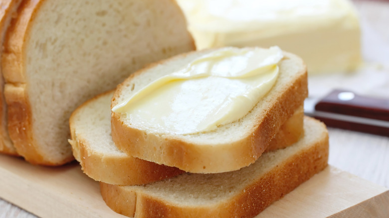 Sliced bread with butter spread on top
