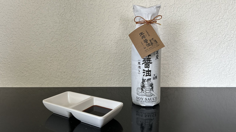 A medium-sized bottle of Takesan Kishibori, wrapped in white paper
